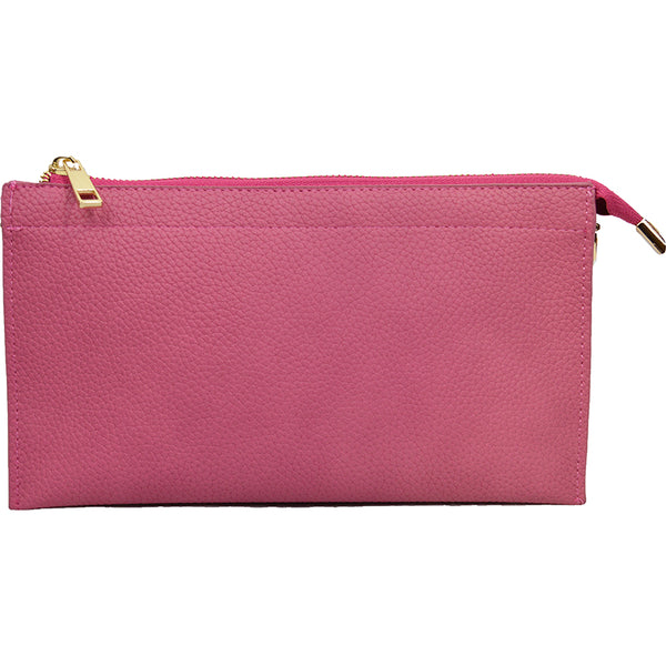 This is It! bag shown as a clutch in hot pink