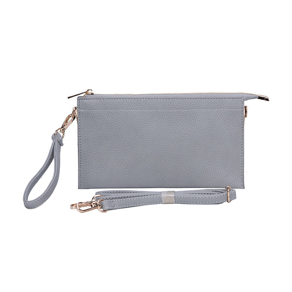 This is It! bag shown in shimmery silver. Wristlet strap is attached.  Crossbody/over the shoulder strap is show in front of the clutch.er 