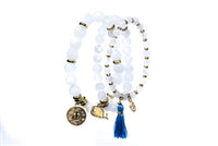 3 piece set of white stones with gold charms and a royal blue tassel.  Each bracelet has different sized stones, gold embellishments.  Can be war, all 3 together or stacked with your favorites