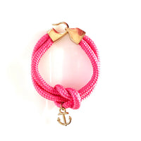 Hot pink cotton rope sailor bracelet with gold anchor charm, hook and loop closure