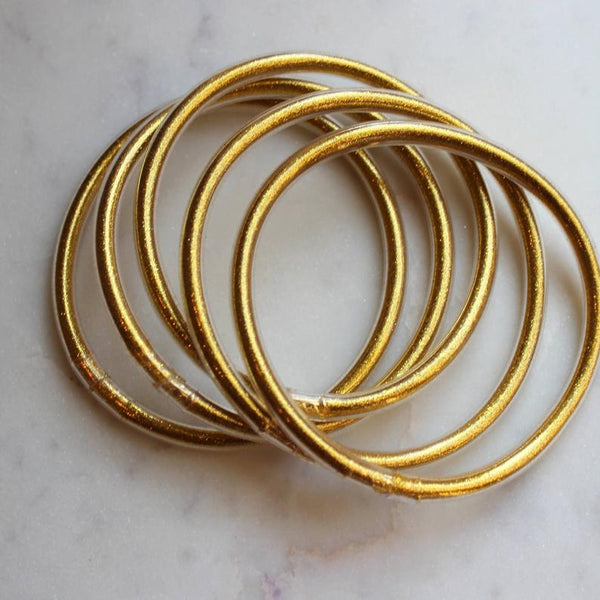 5 piece set of gold shimmer metallic tube bangles
