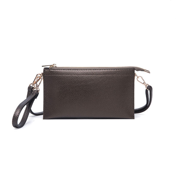 This is It! bag shown with the wristlet handle as well as the over the shoulder strap