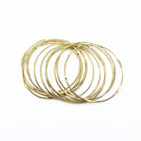 Set of 12 delicate gold bangles